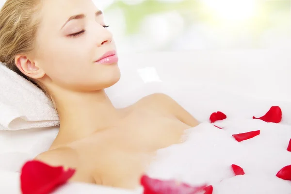 Girl relaxing in bathtub