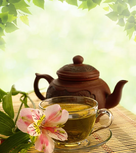 Tea ceremony. Green tea, flower and teapot