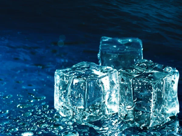 Iced water against abstract blue backgrounds for your design