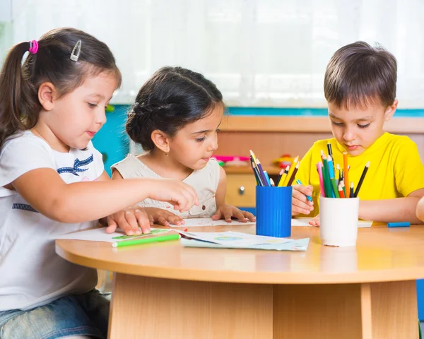 Group of cute little prescool kids drawing