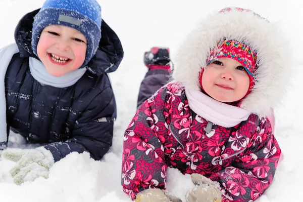 Two cute children playing in winter