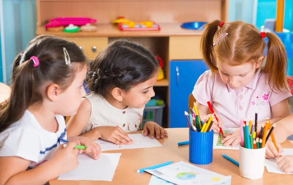 Group of cute little prescool kids drawing