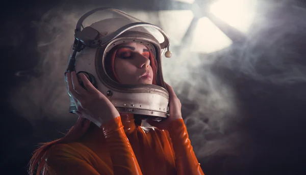 Portrait of astronaut girl in helmet