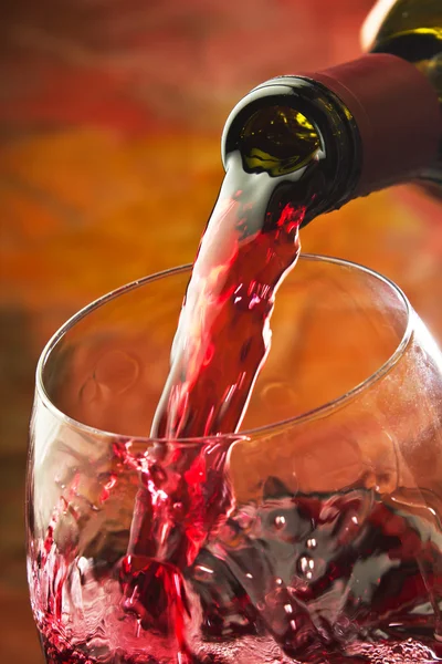 Red wine being poured into wine glass