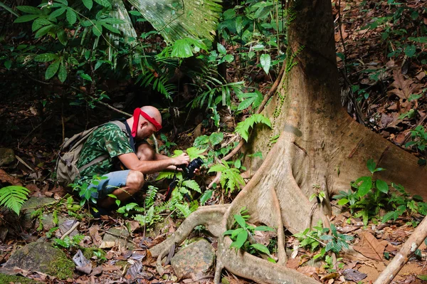 Young man photographed in tropical jungles of southern Thailand