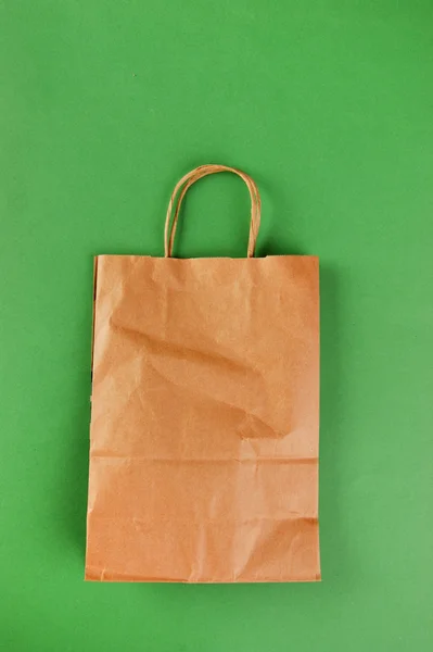 Paper bag on a green background