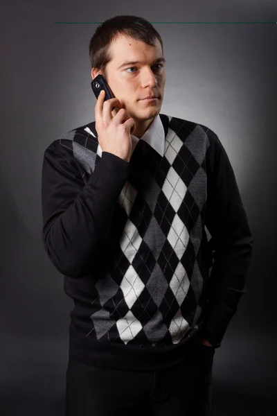 Businessman uses cell phone
