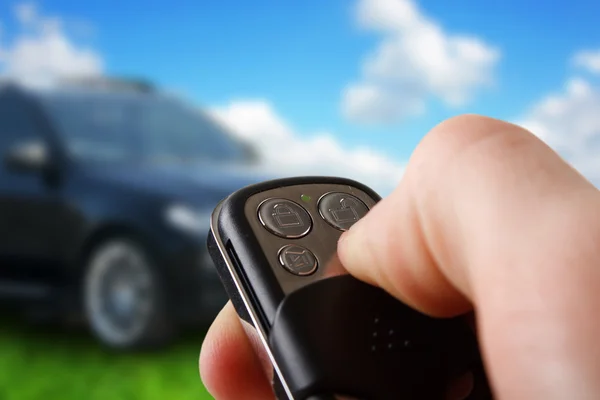 Closeup of male hand holding remote control car key