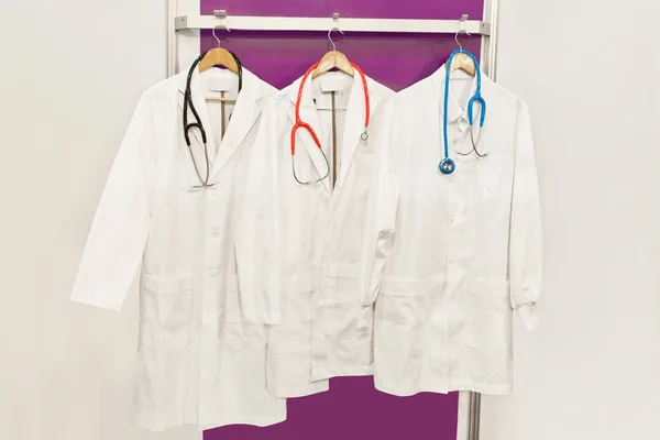 White robe hanging on a door in laboratory