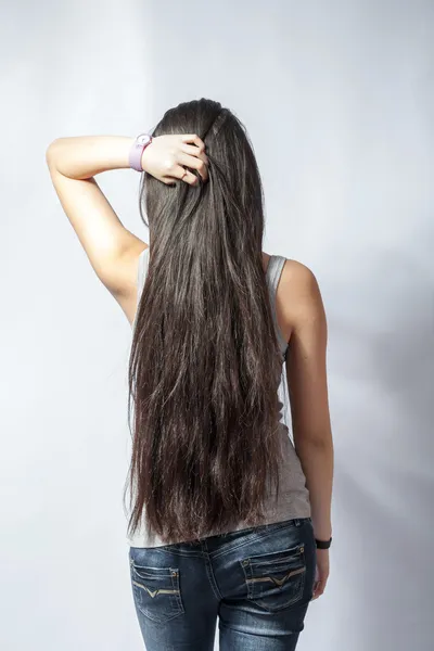 Girl with long fair hair from back