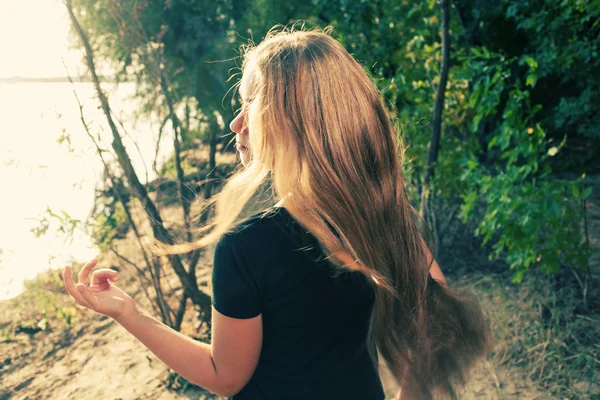 Long haired blonde from back image