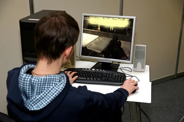 Young man playing computer game