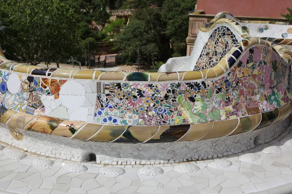 Fragmenes of Gaudi\'s mosaic work in Park Guell in Barcelona, Spain
