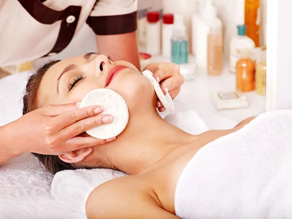 Woman getting facial massage .