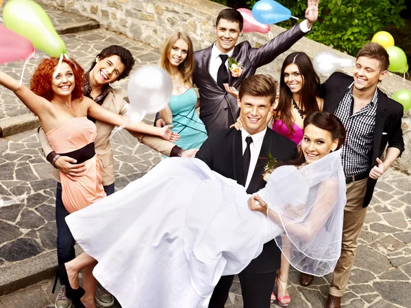 Group people at wedding outdoor.