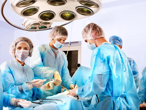 Surgeon at work in operating room.