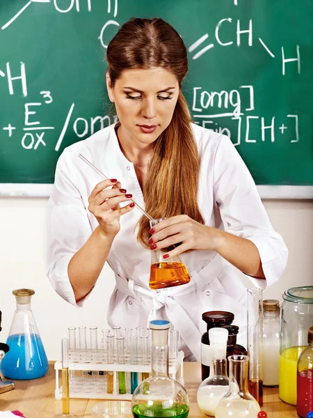 Chemistry teacher at classroom.