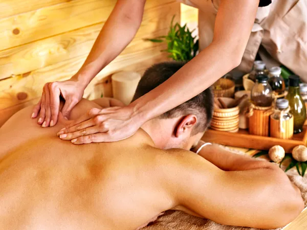 Woman getting bamboo massage.
