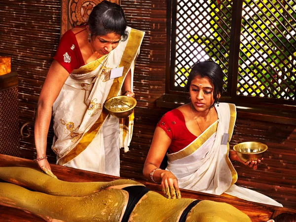 Woman having Ayurvedic body spa massage.