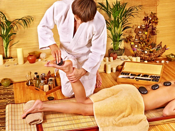 Woman getting feet massage.