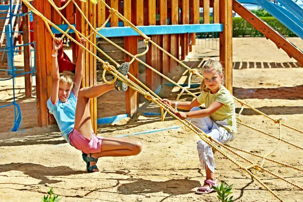 Children move out to slide in playground