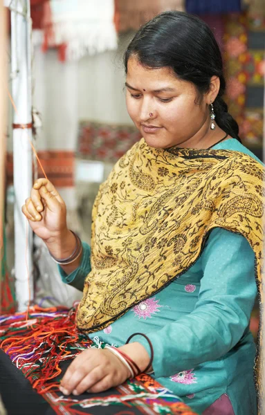 Young indian woman weaver