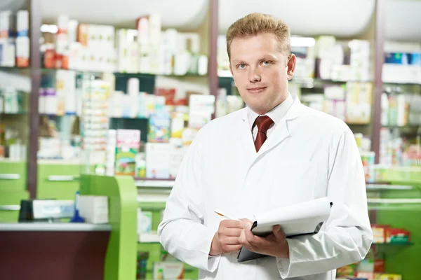 Pharmacy chemist man in drugstore