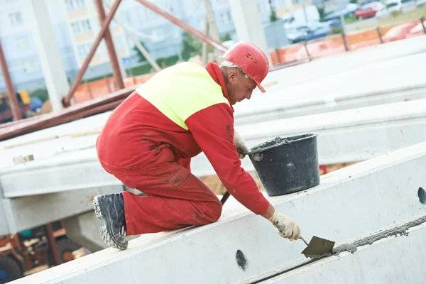 Builder worker stop up concrete slab