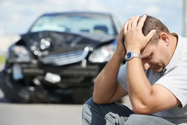 Upset man after car crash