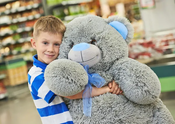 Little boy with bear toy