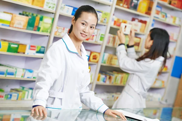 Chinese pharmacy worker in china drugstore