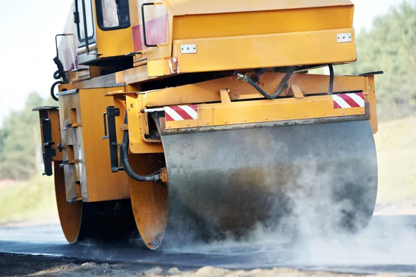 Compactor roller at asphalting work