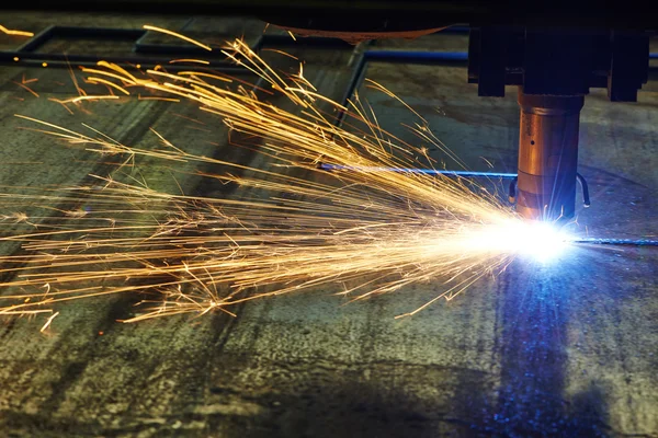 Laser or plasma cutting of metal sheet with sparks