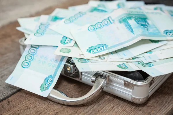 Opened steel case with Russian banknotes