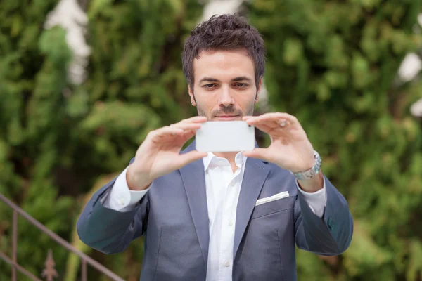 Young Businessman Taking Photos with Mobile