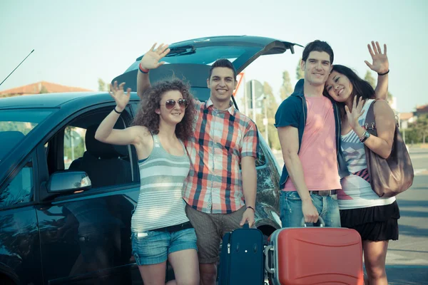 Four Friends Ready to Leave For Vacation — Stock Photo #12749292