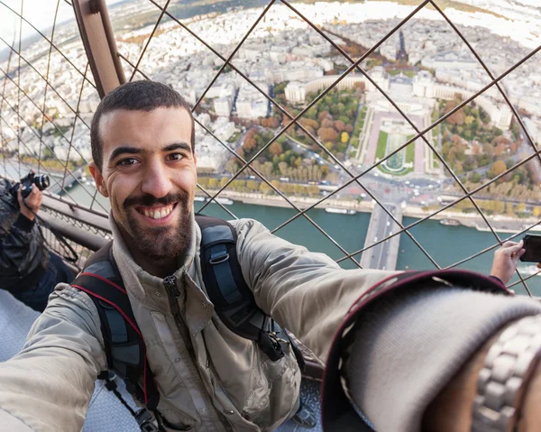 Young Man on the top of Tour Eiffel in Paris