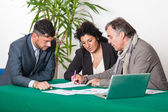 Mature Couple with Financial Consultant — Stock Photo