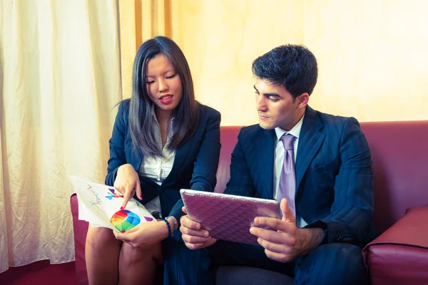 Young Business Couple on the Sofa