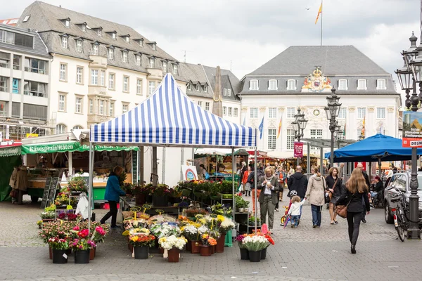 BONN, GERMANY - MAY 6, 2014: Stands and people in Market Square