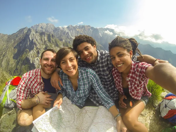 Friends Taking Selfie at Top of Mountain