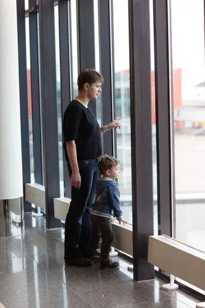 Family looking at airplane