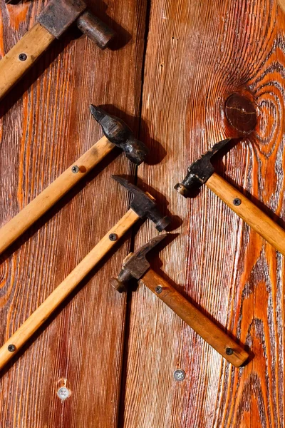 Hammers on the wood background