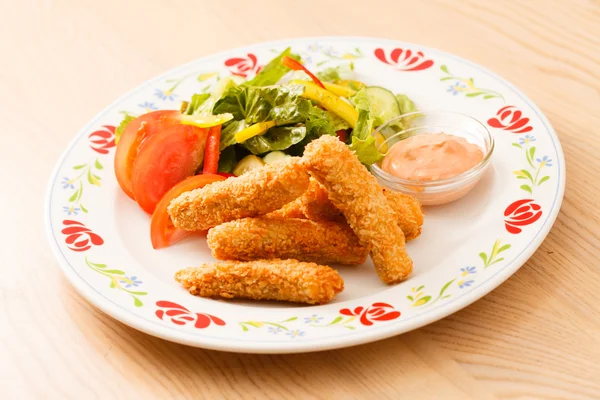 Fish fingers with vegetables