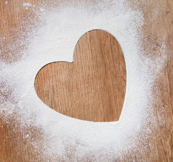The heart of the flour on the table from the old boards. dramati