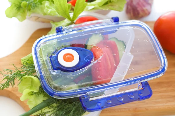 Salad from vegetables in the container.