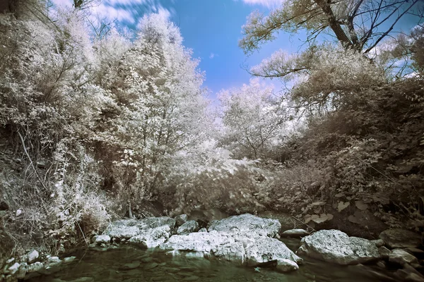 Mountain river with stones infrared (IR) landscape