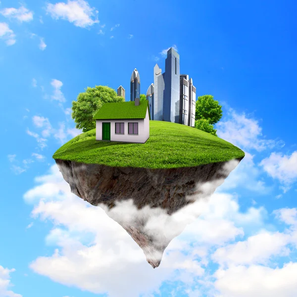 A piece of land in the air with house and tree.