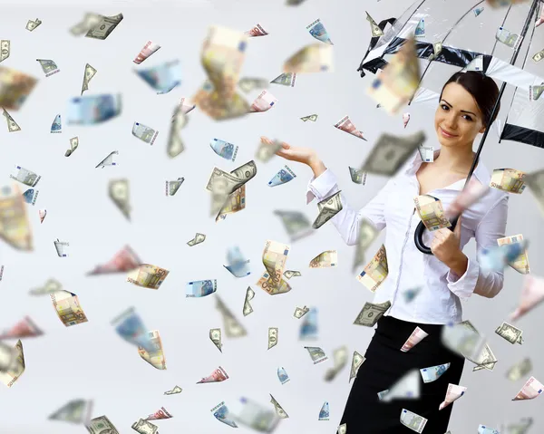 depositphotos_9081800-Business-woman-under-money-rain-with-umbrella.jpg