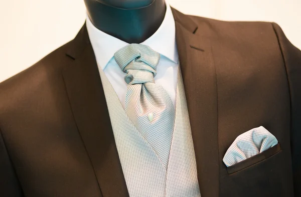 Groom's wedding suit detail on a mannequin